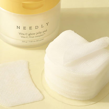 NEEDLY Vita C glow jelly pad with a jar on a light background